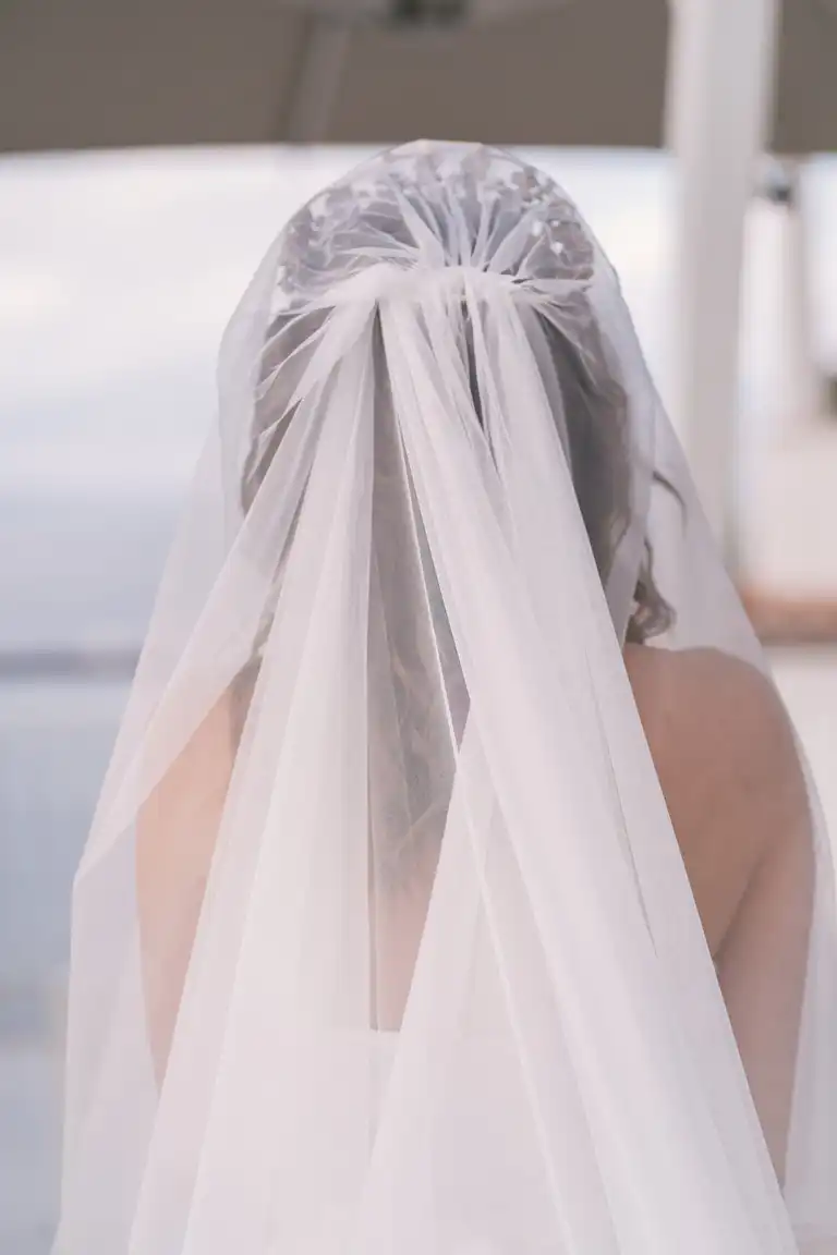 A bride shot from behind with veil for her destination wedding in Sorrento