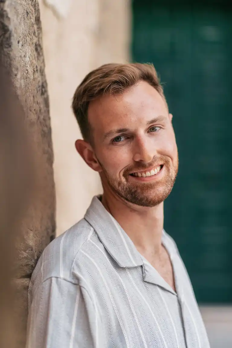 A beatiful man smiling at his fiancé in Positano