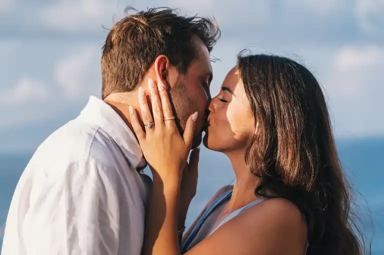 Expression of love and affection for this suprise proposal in Sorrento as they kiss each other while she wears the ring