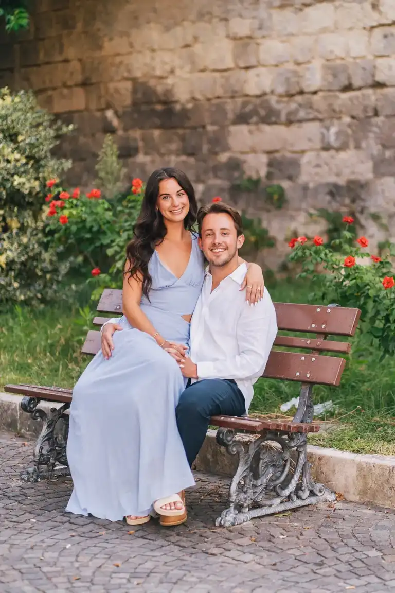 Couple sitting on a bench for a couple photoshoots in Sorrento