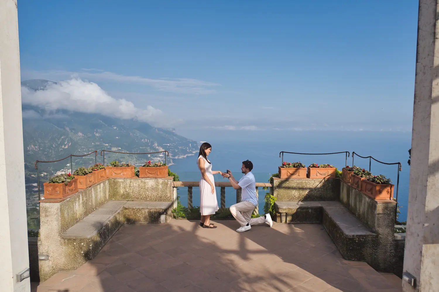 Man proposing to his girlfriend on the balcony of Villa Rufolo in Ravello