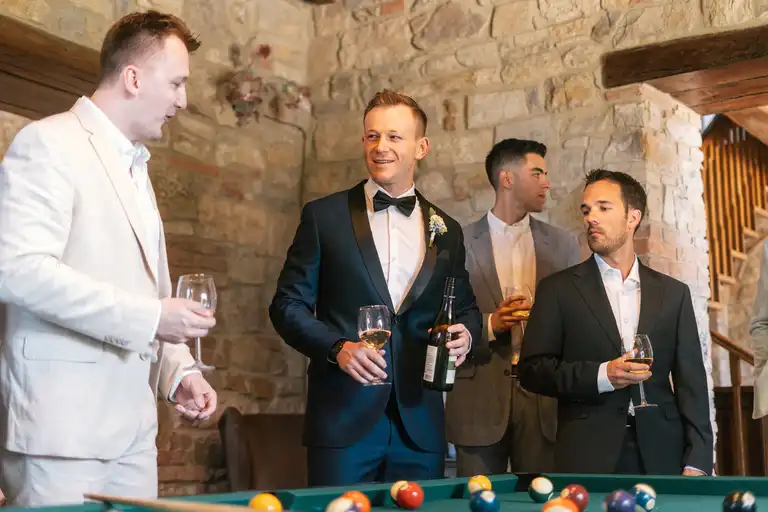 Broom with his friends chatting in front of a pool table