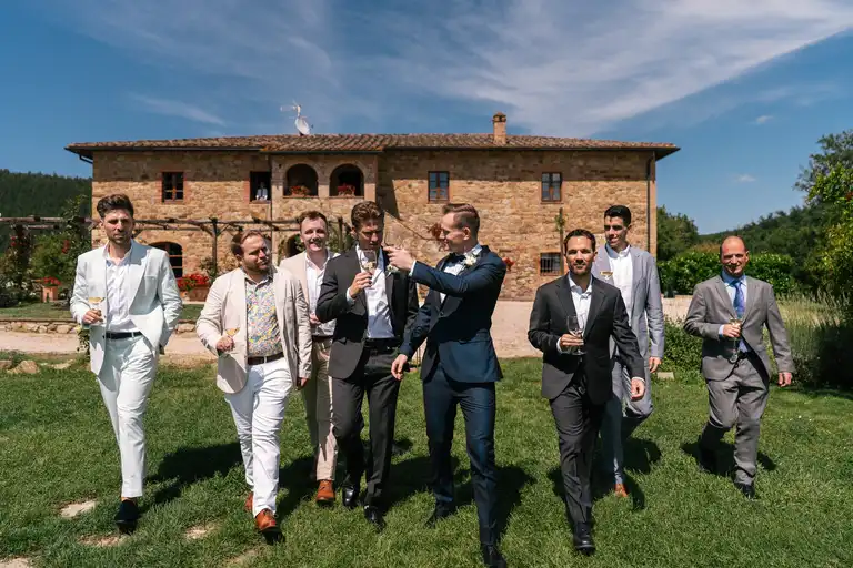 Broom with his friends and best man walk dramatically towards the camera
